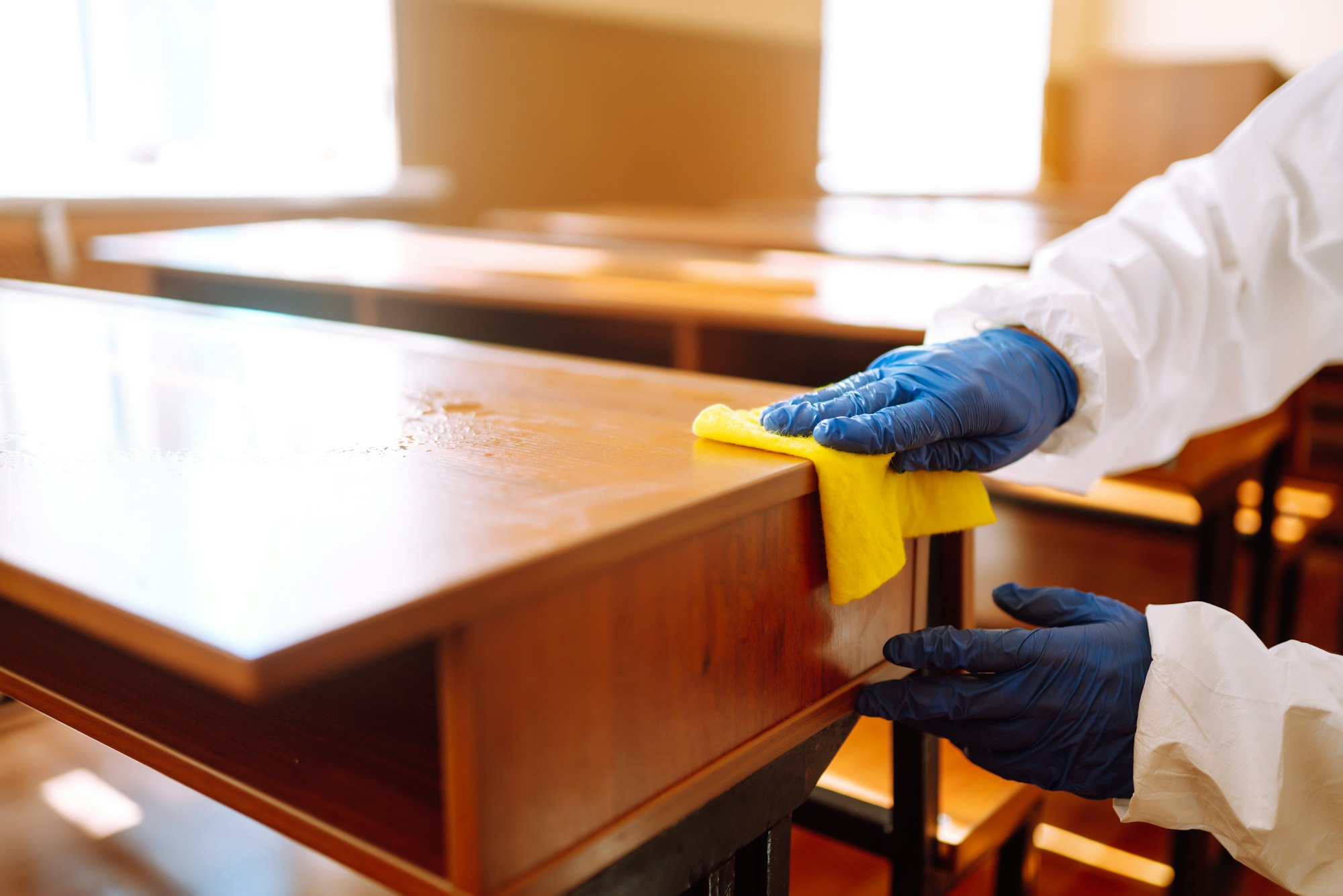 Cleaning and disinfection school desk during coronavirus pandemic. COVID-19.